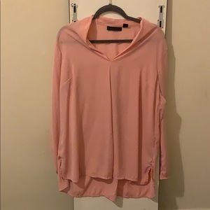 Pink high low long sleeve blouse with V neck.